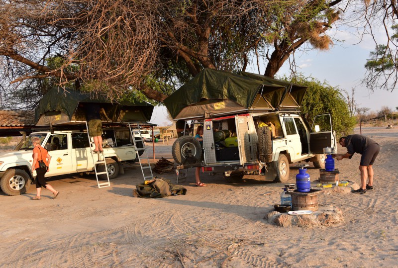 Two safari jeeps and camping in wilderness